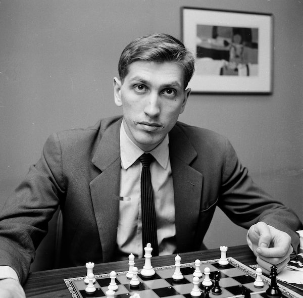 FILE - This April 28, 1962 file photo shows chess star Bobby Fischer of Brooklyn, N.Y., in New York. The remains of chess genius Bobby Fischer are to be exhumed to determine whether he is the father of a 9-year-old girl, a lawyer representing the child and her mother said Thursday June 17, 2010. Thordur Bogason, a lawyer based in the Icelandic capital of Reykjavik, said the country's Supreme Court made the decision earlier this week in order to allow for tests so his client, Jinky Young, can find out who her father is. Fischer, 64, died in Iceland in January 2008. He left no will, Bogason said, adding legal cases over who has the right to the U.S.-born player's estate are ongoing.  (AP Photo/John Lent)