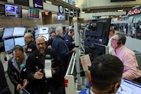 FILE PHOTO: Futures-options traders work on the floor at the New York Stock Exchange's NYSE American (AMEX) in New York City, U.S., April 17, 2026.  REUTERS/Brendan McDermid/File Photo