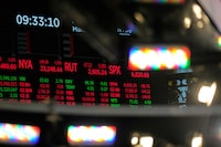 Financial data is displayed on the floor at the New York Stock Exchange in New York, Monday, March 2, 2026. (AP Photo/Seth Wenig)
