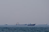 Ships in the Strait of Hormuz off the coast of Musandam, Oman, Monday.