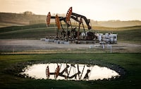 Pumpjacks draw out oil and gas from a wellhead near Calgary on Sunday, May 12, 2024. THE CANADIAN PRESS/Jeff McIntosh
