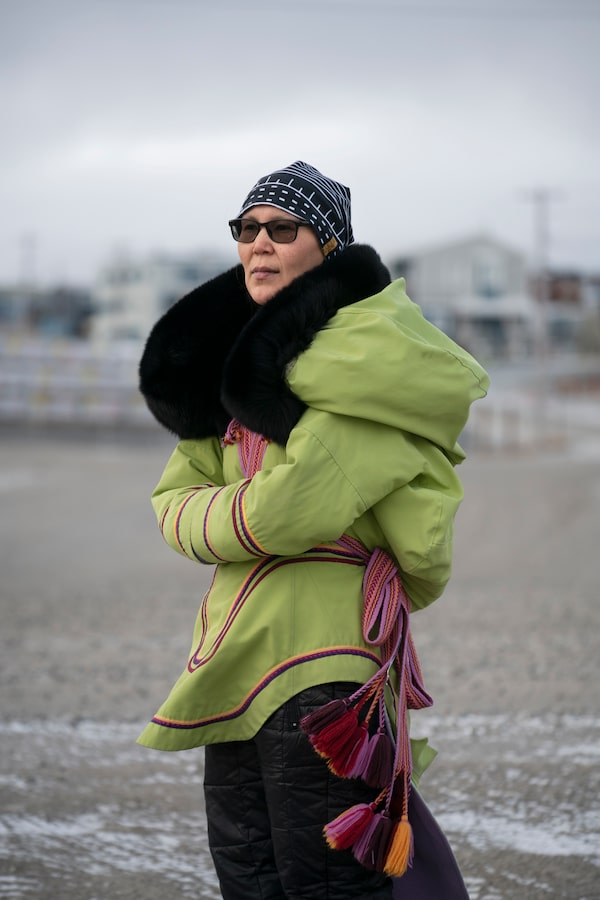With her two week old daughter Trudi is snug inside the hood of her amauti, Tapia Tattuinee is photographed in Rankin Inlet, Nunavut, on Oct 21, 2022.