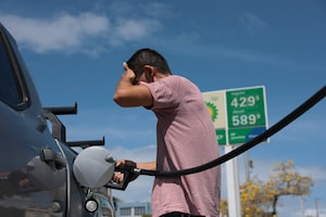 A driver fills up at a gas station in Miami.