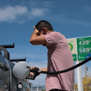 A driver fills up at a gas station in Miami.