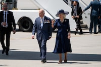 King Charles, left, and Queen Camilla walk on the tarmac of the Ottawa International Airport in Ottawa on Tuesday, May 27, 2025. THE CANADIAN PRESS/Spencer Colby