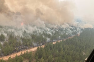 Firefighting crews conduct ignition operations in response to the Fiftynine Creek wildfire northwest of Clinton, B.C., in this handout photo, on Tuesday, July 21, 2026. THE CANADIAN PRESS/Handout — BC Wildfire Service (Mandatory Credit)