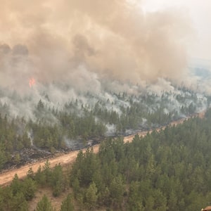 Firefighting crews conduct ignition operations in response to the Fiftynine Creek wildfire northwest of Clinton, B.C., in this handout photo, on Tuesday, July 21, 2026. THE CANADIAN PRESS/Handout — BC Wildfire Service (Mandatory Credit)