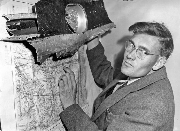 An unidentified mountain climber holds a piece of airplane wreckage, May 1957, part of TCA North Star found at 7,600-foot level on Mount Slesse in British Columbia. Mount Slesse, a jagged 2,500-metre peak near Chilliwack, known locally as "The Fang", lived up to its evil reputation on December 9, 1956, when Trans-Canada Airlines Flight 810 slammed into it, killing all 62 aboard. For five months nobody knew what happened. Flight 810 had just disappeared into the night. Adding to the sensation was the fact that the flight carried five professional football players fresh from the CFL ALL-Star Game in Vancouver and a mystery man by the name of Kwan Song who was rumoured to be carrying a sizeable fortune in cash. Finally, on May 12, 1957, a diminutive female mountaineer named Elfrida Pigou discovered the gruesome crash site, setting off a stampede of macabare treasure hunters.  Credit unknown.