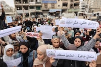 Displaced Palestinian university students rally against travel restrictions that hinder their education access in Gaza on Monday.