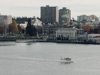 A Float Plane crosses the inner harbour in front of Parliment in Victoria British Columbia. November 20th 2023