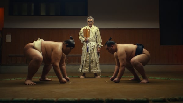 Eugene Levy meets Kensho Sawada and Yoshinori Tashiro while visiting Tokyo in “The Reluctant Traveler,” premiering Friday, February 24 on Apple TV+.