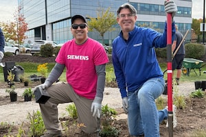Employees at Siemens Canada plant a pollinator garden at the company’s headquarters in Oakville, Ontario.