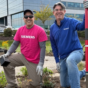 Employees at Siemens Canada plant a pollinator garden at the company’s headquarters in Oakville, Ontario.