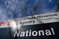 The Canada Revenue Agency says it is ramping up efforts to claw back overpayments of pandemic-related benefits. The Canada Revenue Agency sign outside the National Headquarters at the Connaught Building in Ottawa is seen on Monday, March 1, 2021. THE CANADIAN PRESS/Justin Tang