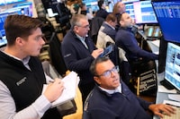 Traders work on the floor at the New York Stock Exchange in New York, Monday, March 2, 2026. (AP Photo/Seth Wenig)