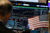 FILE PHOTO: A trader works at his post on the floor at the New York Stock Exchange (NYSE) in New York City, U.S., June 1, 2026.  REUTERS/Brendan McDermid/File Photo