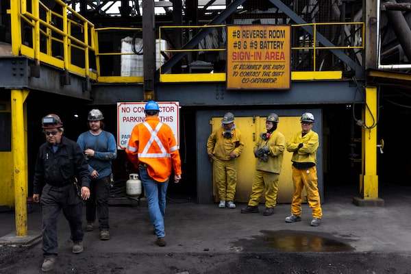 Contract workers take break at Algoma Steel's cokemaking facilities.  Once it makes the EAF transition, the number of employees at the plant will be reduced to almost half of the current workforce.