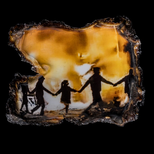 Iranians gather around a bonfire amid anti-government protests as they chant “You’re the pervert. You’re the whore. I’m a free woman” on the streets in Iran in 2022.