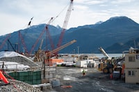 An employee walks through the Woodfibre LNG site near Squamish, B.C., in October. The Woodfibre LNG project has developed a strategy to prevent the exploitation of women and girls living nearby, including a tip line and multiple checkpoints at the work site. 
