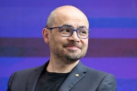 FILE PHOTO: CEO of DeepMind Technologies Demis Hassabis listens during a debate at an AI summit at Imperial College London, in London, Britain, July 9, 2025. LUDOVIC MARIN/Pool via REUTERS/File Photo