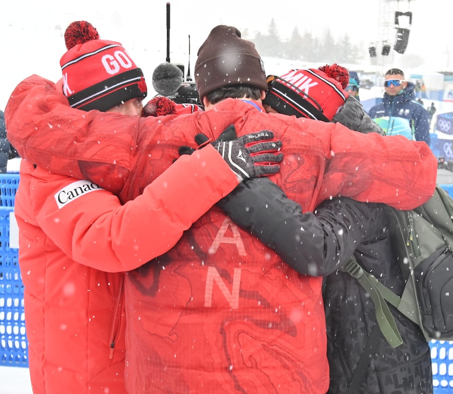 It was time for a hug with family and friends after Canada’s Mikaël Kingsbury, middle, took silver in men’s moguls on Thursday – despite a tie with gold medalist Cooper Woods of Australia.