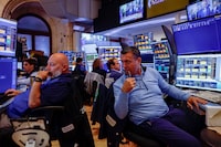 FILE PHOTO: Traders work on the floor of the New York Stock Exchange (NYSE) in New York City, U.S., July 6, 2026. REUTERS/Jeenah Moon/File Photo