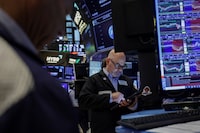 A trader works on the floor at the New York Stock Exchange (NYSE) in New York City, U.S., April 23.
