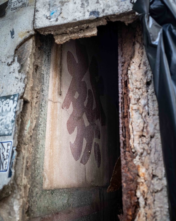 After a car crashed into this building in central Hong Kong, it exposed a terrazzo sign from the early 1900s under the newer brickwork.