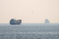Vessels at the Strait of Hormuz, as seen from Musandam, Oman, July 8, 2026. REUTERS/Stringer      TPX IMAGES OF THE DAY