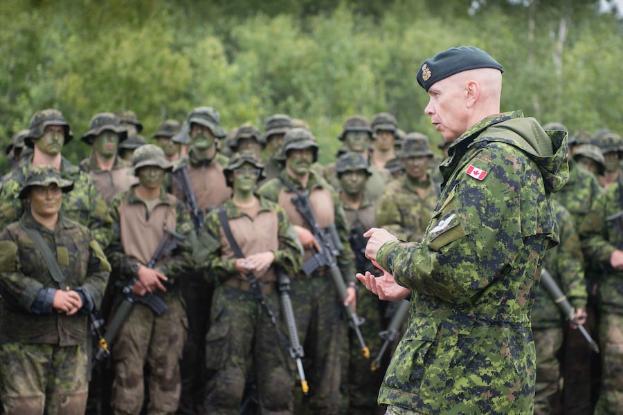 Then-chief of defence staff General Wayne Eyre visits soldiers training at the Canadian forces base in Gagetown, N.B., in 2022. 