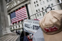 A Wall Street plate is seen on a street vendor stall outside the New York Stock Exchange in New York City, U.S., July 11, 2025. 