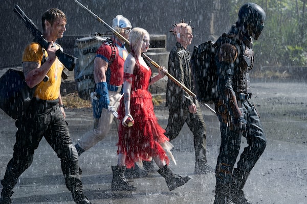 The Suicide Squad -- (L-r) JOEL KINNAMAN as Rick Flag, JOHN CENA as Peacemaker, MARGOT ROBBIE as Harley Quinn, PETER CAPALDI as The Thinker and IDRIS ELBA as Bloodsport in Warner Bros. Pictures’ action adventure “THE SUICIDE SQUAD,” a Warner Bros. Pictures release.