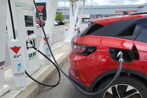 A 2022 Volkswagen ID.4 EV is shown at a charging station at a Scarborough, Ontario Canadian Tire on Wednesday June 14, 2023. Statistics Canada says sales for electric vehicles were up 53 per cent in the first quarter, compared to the same time year. THE CANADIAN PRESS/Doug Ives