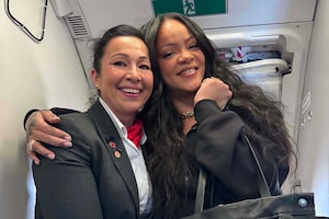 Air Canada flight attendant Lily Kahnerahtiio Dailleboust, left, is pictured with singer Rihanna on a flight on Monday June 1, 2026. THE CANADIAN PRESS/Handout-Lily Kahnerahtiio Dailleboust (Mandatory Credit)