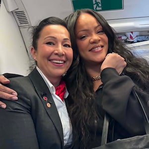 Air Canada flight attendant Lily Kahnerahtiio Dailleboust, left, is pictured with singer Rihanna on a flight on Monday June 1, 2026. THE CANADIAN PRESS/Handout-Lily Kahnerahtiio Dailleboust (Mandatory Credit)