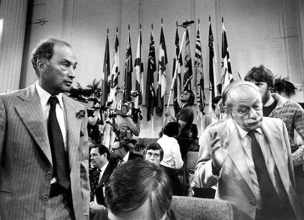 FILE--Quebec Premier Rene Levesque (R) shrugs his shoulders and walks away from Prime Minister Pierre Trudeau (L) after a chat prior to the beginning of the second day of the Constitution Conference Sept 9, 1980.Trudeau is "not well" and is receiving medical attention but he is resting comfortably at his Montreal  home with his two sons.  (CP PICTURE ARCHIVE/Drew Gragg)