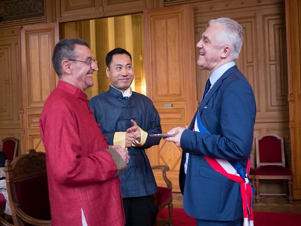 Francois Dupouy and Wu Xianle at their marriage ceremony in Paris on April 26, 2014.
