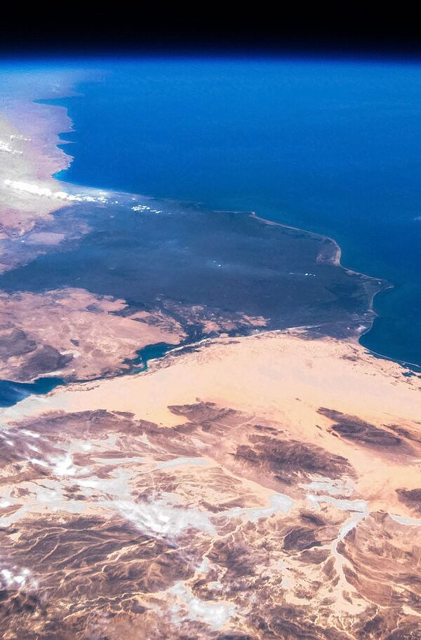  Beyond the greenery of the Nile Delta and across the Suez Canal, the Sinai Peninsula, at bottom, looks desolate from space. Egypt and Israel have fought before over this desert bridge between Africa and Asia.