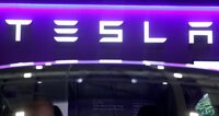 The logo of Tesla on display at the Everything Electric exhibition at the ExCeL London international exhibition and convention centre in London, Britain, March 28, 2024.