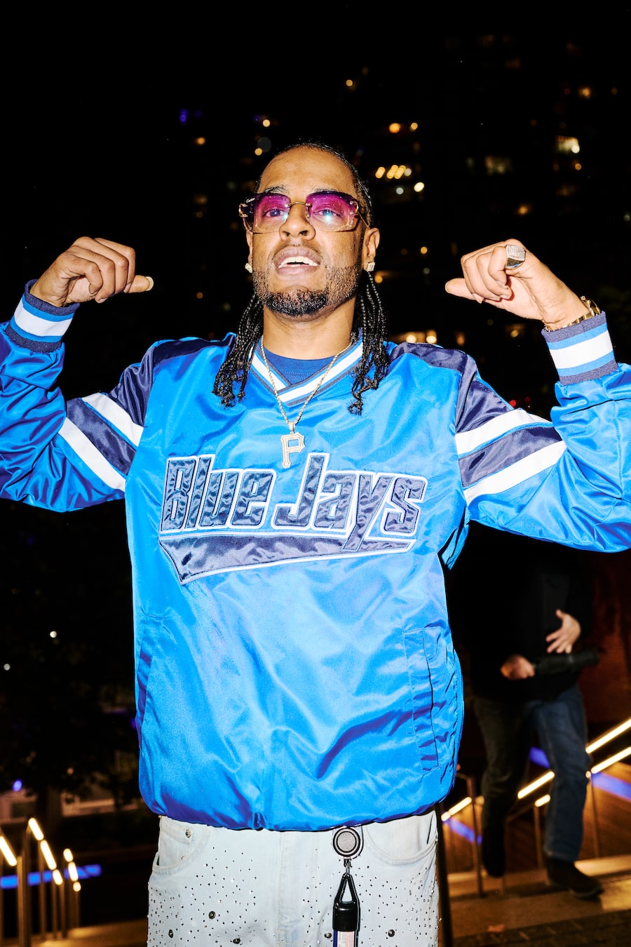 Toronto musician TruRizz is among the fans decked out in Jays gear outside the Rogers Centre before Game 1 of the World Series.