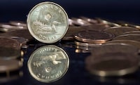 The Canadian dollar coin, the Loonie, is displayed Friday, January 30, 2015 in Montreal. THE CANADIAN PRESS/Paul Chiasson