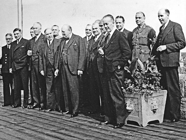 Quebec Conference 1943 Chosen as a site for a war conference of three great powers, historically-famous Que. City was the scene of plans which made possible ai Allied victory. Toy the citadel went the war leaders Prime Min. Winston Churchill of Great Britain, Pres. franklin D. Roosevelt of the U.S.A. and Canada's Prime Minister Mackenzie King as guests the Governor General, the Earl of Athlone and Princess Alice. British and.American Chiefs of Staff and their staffs were housed in the Chateau Frontenac. Prime Ministers Winston Churchill and Mackenzie King are Shown with the members of the British general staff and the Canadian War Council. SHOWN: L to R: Hon.Angus L. Macdonald, Admiral Sir Dudley Pound, vice-Admiral Percy Nelles, Hon. C. G. Power, J. L. Ilsley, T. A. Crerar, PM King, Air Marshal L. S. Breadner, J. L. Ralston, PM Churchill, Louis St. Laurent J. E. Michaud, Gen. Kenneth Stuart, C. D. Howe, Arnold P. Heeney, (gentleman Beside Mr. Howe unidentified), Ge. Sir H stings Ismay, Norman Robertson.