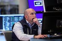 A trader works at the New York Stock Exchange in New York on April 22, 2026. (Photo by ANGELA WEISS / AFP via Getty Images)