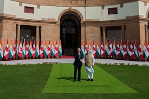 Indian Prime Minister Narendra Modi, right, shakes hands with his Canadian counterpart Mark Carney before their delegation level meeting in New Delhi, India, Monday, March 2, 2026. (AP Photo/Manish Swarup)