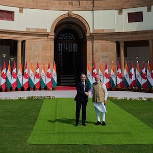 Indian Prime Minister Narendra Modi, right, shakes hands with his Canadian counterpart Mark Carney before their delegation level meeting in New Delhi, India, Monday, March 2, 2026. (AP Photo/Manish Swarup)