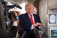 President Donald Trump speaks to reporters aboard Air Force One en route from Joint Base Andrews, Md., to Eau Claire, Wis., Friday, June 5, 2026. (AP Photo/Mark Schiefelbein)