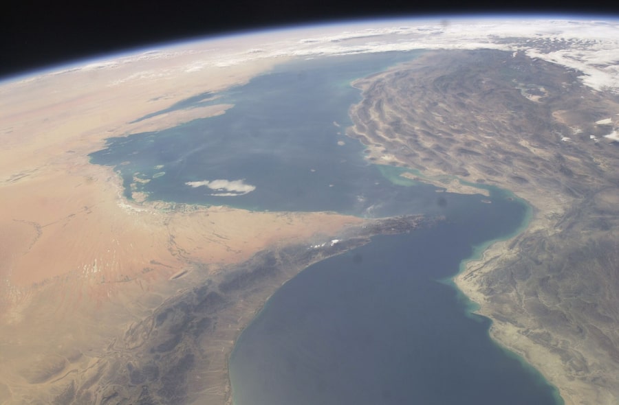 Between the Persian Gulf, top, and the Gulf of Oman, bottom, is the narrow Strait of Hormuz. Ships could cross it more freely when the International Space Station took this photo in 2003, but recently, war between the United States, Israel and Iran has hobbled sea traffic through it.