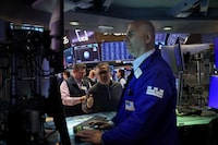 Traders work on the floor at the New York Stock Exchange (NYSE) in New York City, U.S., April 8.