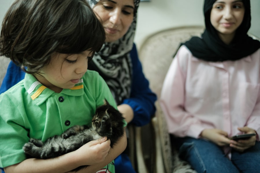 Nama Soliman fled Gaza with her nine children, including Joury, left, and Remas, right. The family now lives in Cairo with her husband Maher, in a three-room apartment. 