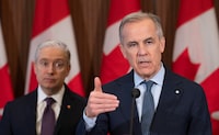 Finance and National Revenue Minister Francois-Philippe Champagne and Prime Minister Mark Carney during an announcement on Parliament Hill in Ottawa on April 14.